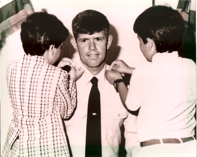 Kevin and Jeffrey pinning on dad's rank to major in Washington, D.C., 1986.